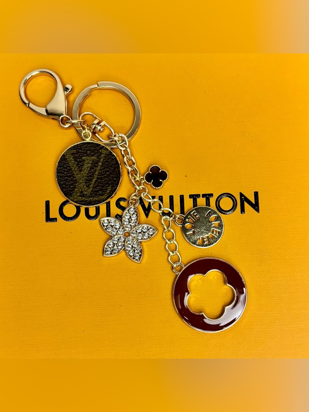 Louis Vuitton Gold-Tone
Monogram Bag Charm, Clover, Rhinestone accents 6.5 in